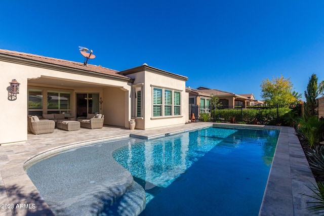 view of swimming pool with outdoor lounge area and a patio area