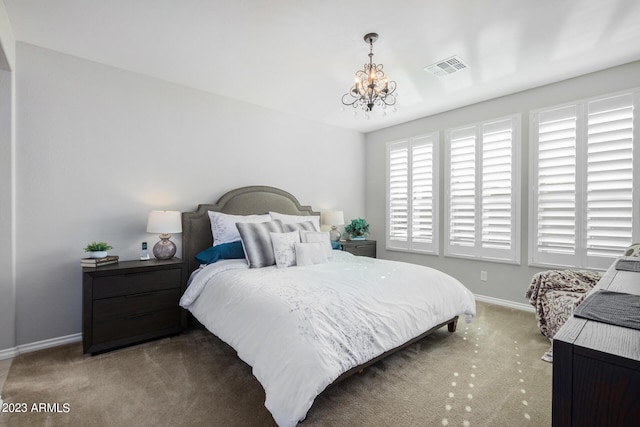 bedroom with light colored carpet and a chandelier