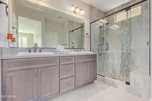 bathroom with vanity, tile patterned floors, and an enclosed shower