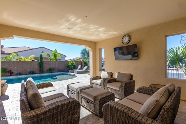 view of patio featuring an outdoor living space and a fenced in pool