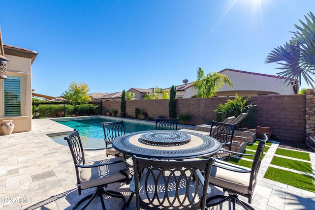 view of swimming pool with a patio area