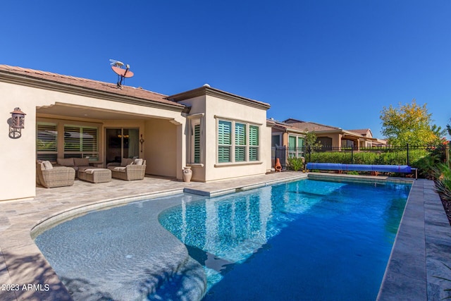 view of swimming pool with outdoor lounge area and a patio area