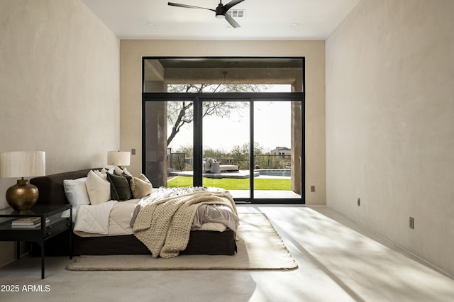 bedroom featuring access to exterior, visible vents, and concrete flooring