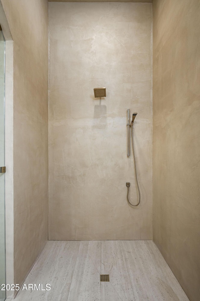 full bathroom with a tile shower