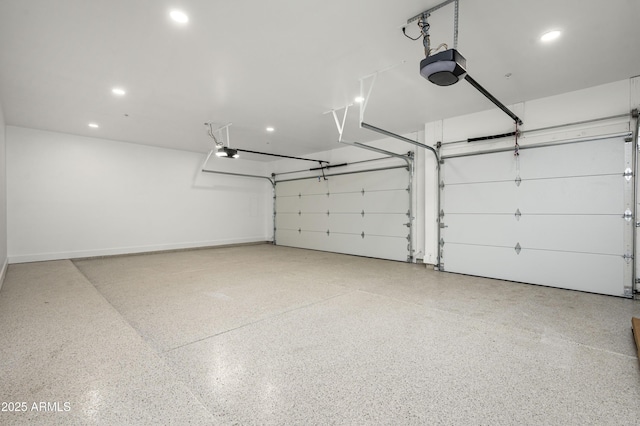 garage with recessed lighting, baseboards, and a garage door opener