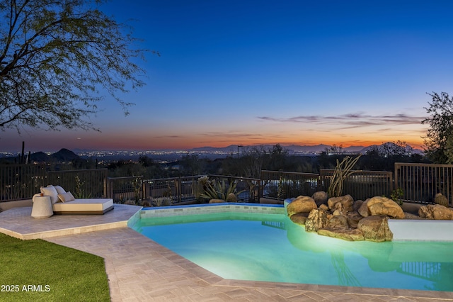 view of pool with a patio area, fence, and a fenced in pool