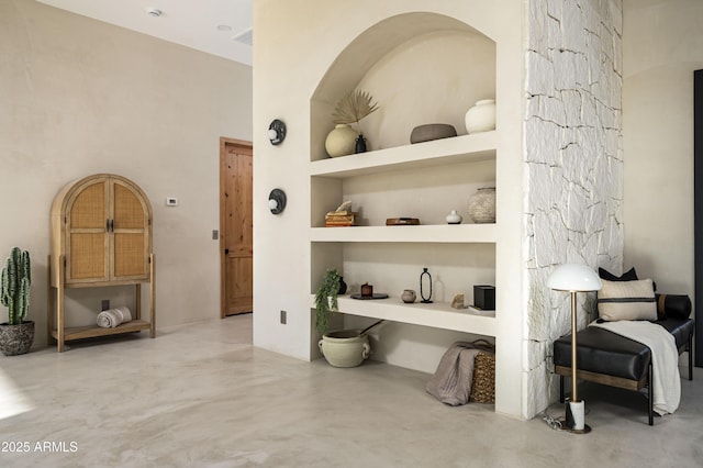 room details featuring finished concrete flooring and built in features