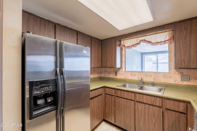1654 E 2nd St, Mesa, AZ 85203 - kitchen with stainless steel fridge with ice dispenser, a sink, and light countertops