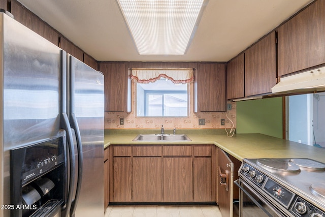 1654 E 2nd St, Mesa, AZ 85203 - kitchen with stainless steel fridge, electric range oven, a sink, light countertops, and under cabinet range hood