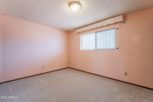 1654 E 2nd St, Mesa, AZ 85203 - spare room featuring a textured ceiling, light colored carpet, and baseboards