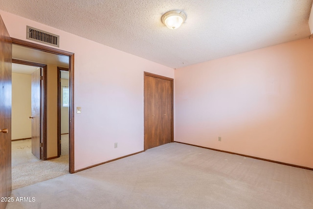 1654 E 2nd St, Mesa, AZ 85203 - empty room featuring carpet, a textured ceiling, and baseboards