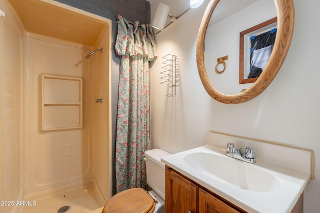 1654 E 2nd St, Mesa, AZ 85203 - bathroom featuring vanity, a stall shower, and toilet