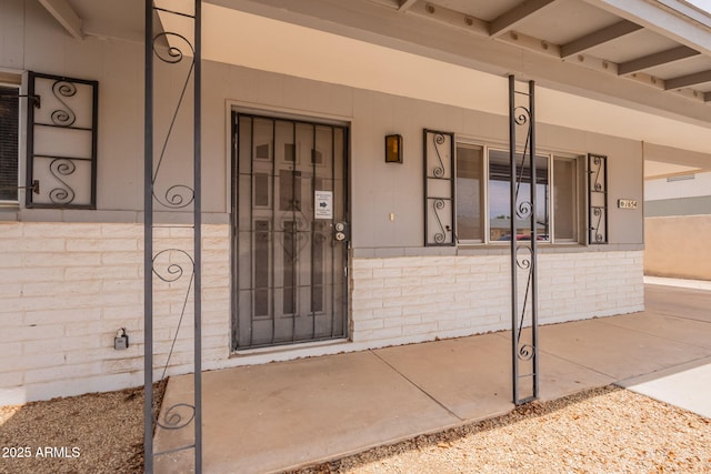 1654 E 2nd St, Mesa, AZ 85203 - entrance to property with a porch and brick siding