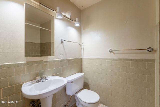 1654 E 2nd St, Mesa, AZ 85203 - full bath with toilet, a sink, tile walls, a shower, and a wainscoted wall