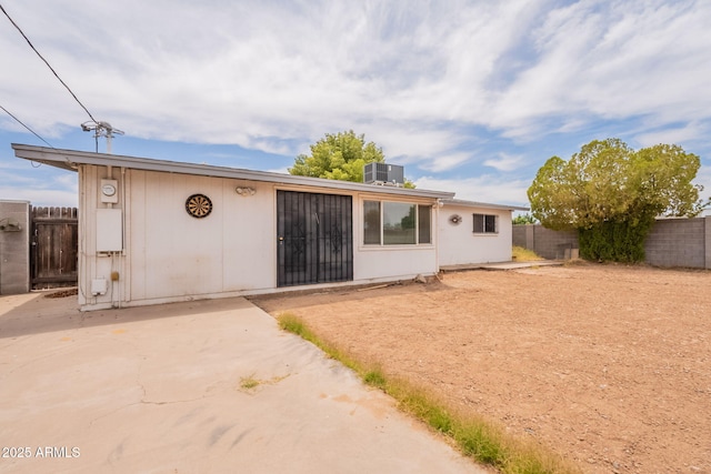 1654 E 2nd St, Mesa, AZ 85203 - back of property with a fenced backyard, central AC, and a patio