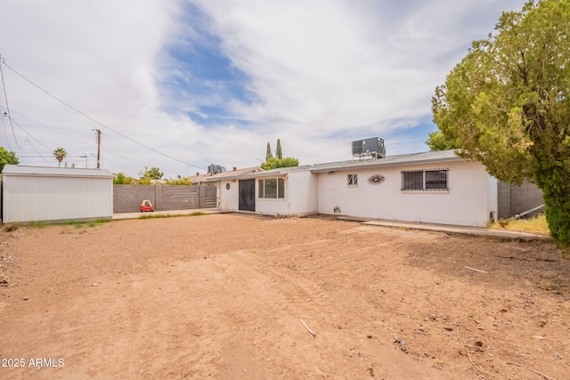 1654 E 2nd St, Mesa, AZ 85203 - rear view of house with central AC and an outdoor structure