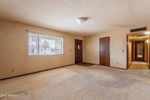 1654 E 2nd St, Mesa, AZ 85203 - empty room with carpet floors, a textured ceiling, and baseboards