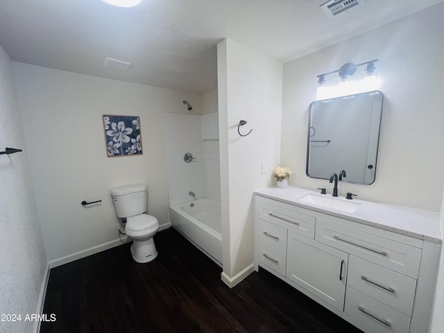 full bathroom with tub / shower combination, hardwood / wood-style floors, toilet, and vanity