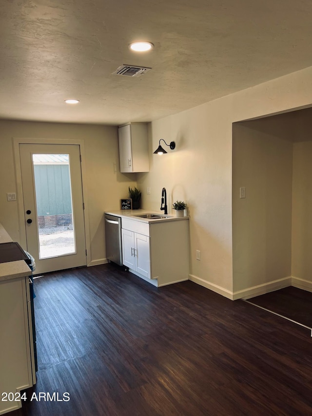 kitchen with range, dishwasher, dark hardwood / wood-style floors, and sink