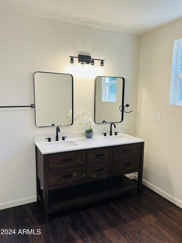 bathroom with vanity and hardwood / wood-style floors