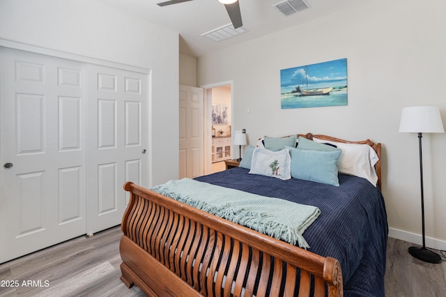 24638 N 144th Ave, Surprise, AZ 85387 - bedroom with wood finished floors, ceiling fan, a closet, and baseboards
