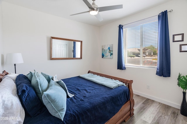 24638 N 144th Ave, Surprise, AZ 85387 - bedroom featuring wood finished floors, baseboards, and ceiling fan