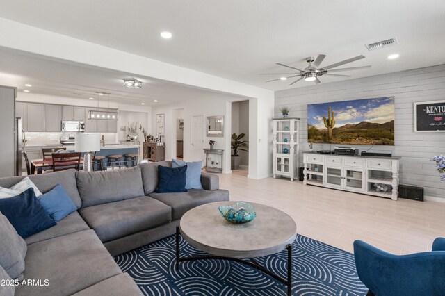 24638 N 144th Ave, Surprise, AZ 85387 - living area featuring ceiling fan, recessed lighting, and wood walls