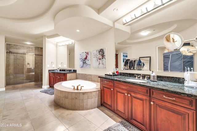 bathroom featuring vanity, independent shower and bath, and tile patterned flooring