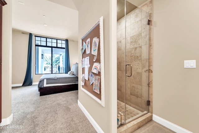 bathroom featuring a shower with door