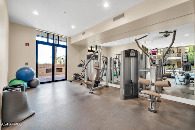 workout area featuring expansive windows