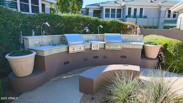 15221 N Clubgate Dr Unit 2044, Scottsdale, AZ 85254 - view of patio with an outdoor kitchen