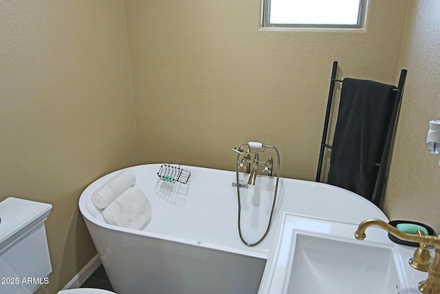 15221 N Clubgate Dr Unit 2044, Scottsdale, AZ 85254 - bathroom featuring a freestanding tub and toilet