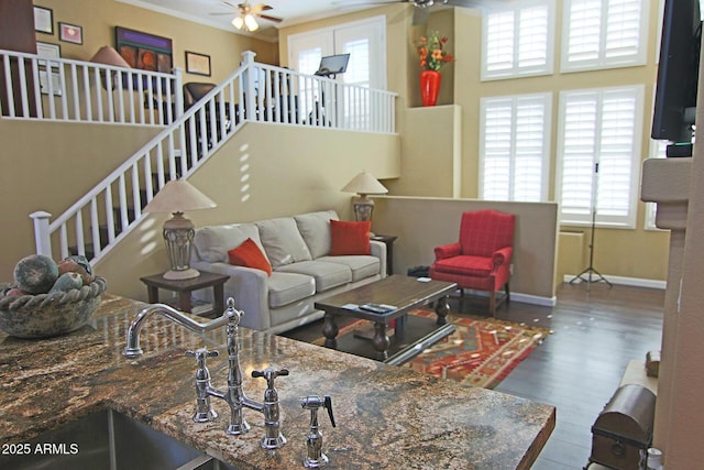 15221 N Clubgate Dr Unit 2044, Scottsdale, AZ 85254 - living area with a ceiling fan, plenty of natural light, wood finished floors, and stairs
