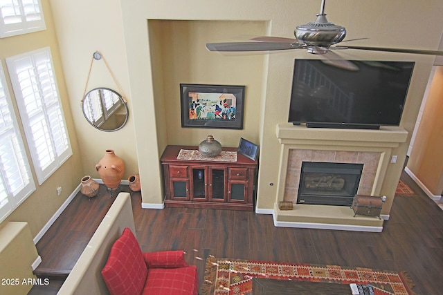15221 N Clubgate Dr Unit 2044, Scottsdale, AZ 85254 - living area with wood finished floors, ceiling fan, and a fireplace