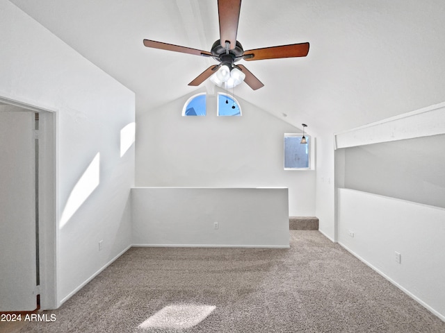 bonus room with ceiling fan, light colored carpet, and lofted ceiling