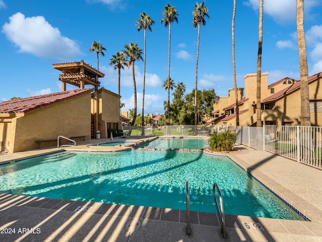 view of swimming pool with a patio