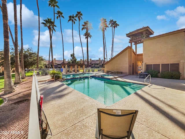 view of swimming pool featuring a patio