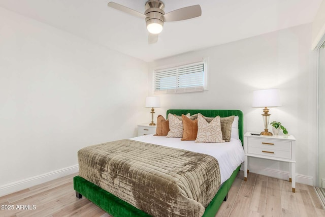 8437 E Bonnie Rose Ave, Scottsdale, AZ 85250 - bedroom with light wood-type flooring, baseboards, and a ceiling fan