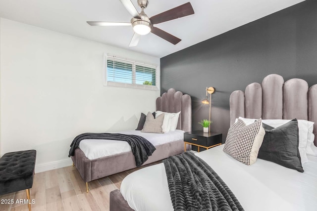 8437 E Bonnie Rose Ave, Scottsdale, AZ 85250 - bedroom with wood finished floors, baseboards, and a ceiling fan