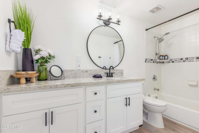 8437 E Bonnie Rose Ave, Scottsdale, AZ 85250 - bathroom featuring vanity, shower / tub combination, wood finished floors, and toilet