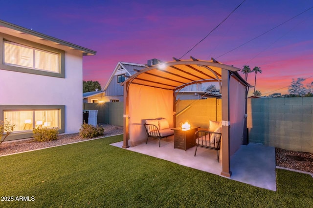 8437 E Bonnie Rose Ave, Scottsdale, AZ 85250 - patio terrace at dusk with an outdoor fire pit