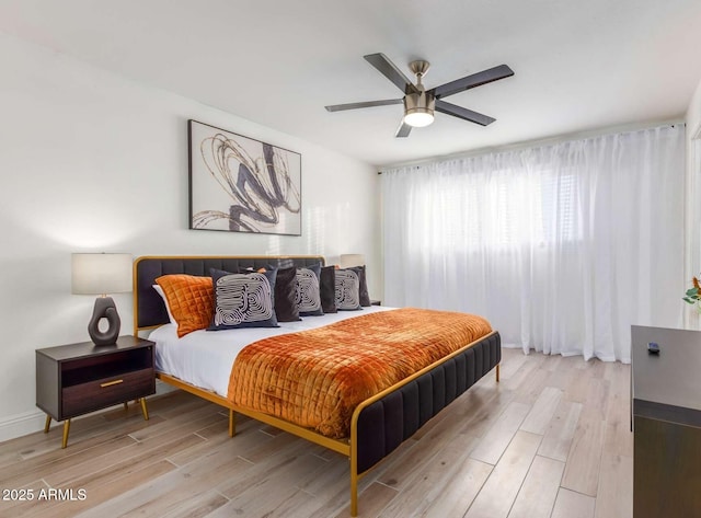 8437 E Bonnie Rose Ave, Scottsdale, AZ 85250 - bedroom with light wood-style floors and a ceiling fan