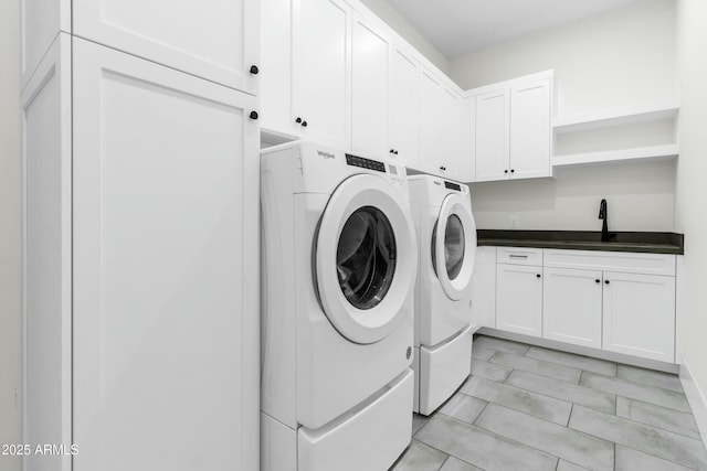 908 W Caldwell St, Phoenix, AZ 85041 - laundry room featuring washing machine and clothes dryer, a sink, and cabinet space