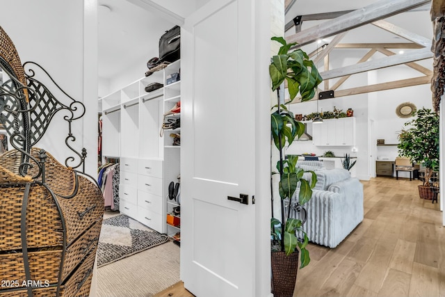 908 W Caldwell St, Phoenix, AZ 85041 - spacious closet featuring beamed ceiling, high vaulted ceiling, and light wood finished floors