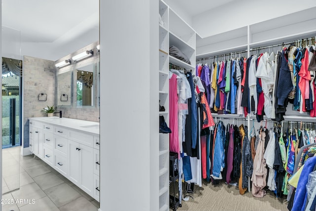908 W Caldwell St, Phoenix, AZ 85041 - spacious closet featuring a sink and tile patterned flooring