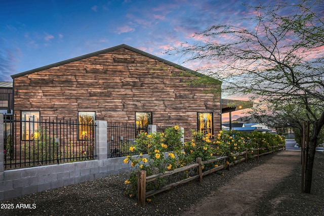 908 W Caldwell St, Phoenix, AZ 85041 - view of property exterior with fence and stone siding