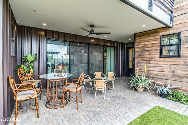 908 W Caldwell St, Phoenix, AZ 85041 - view of patio featuring outdoor dining space, a ceiling fan, and an outdoor fire pit