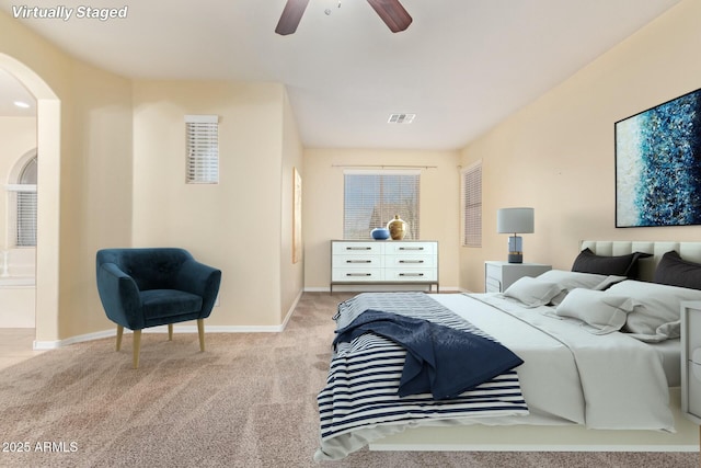 bedroom with light colored carpet and ceiling fan