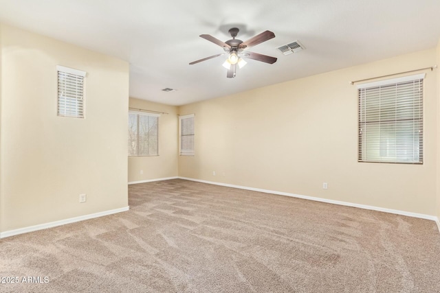 unfurnished room with light carpet and ceiling fan