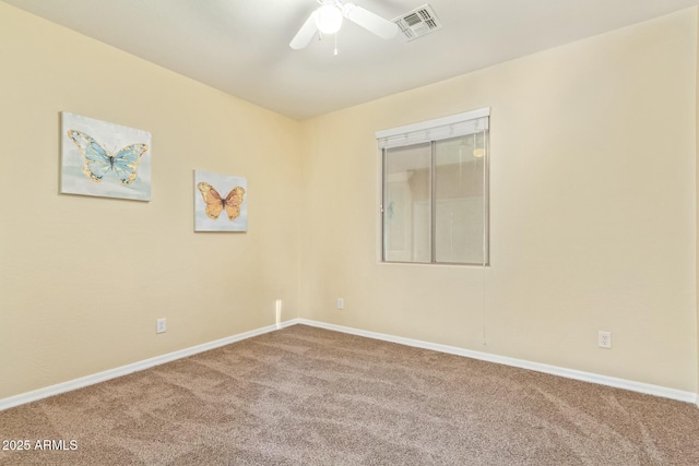 carpeted empty room featuring ceiling fan